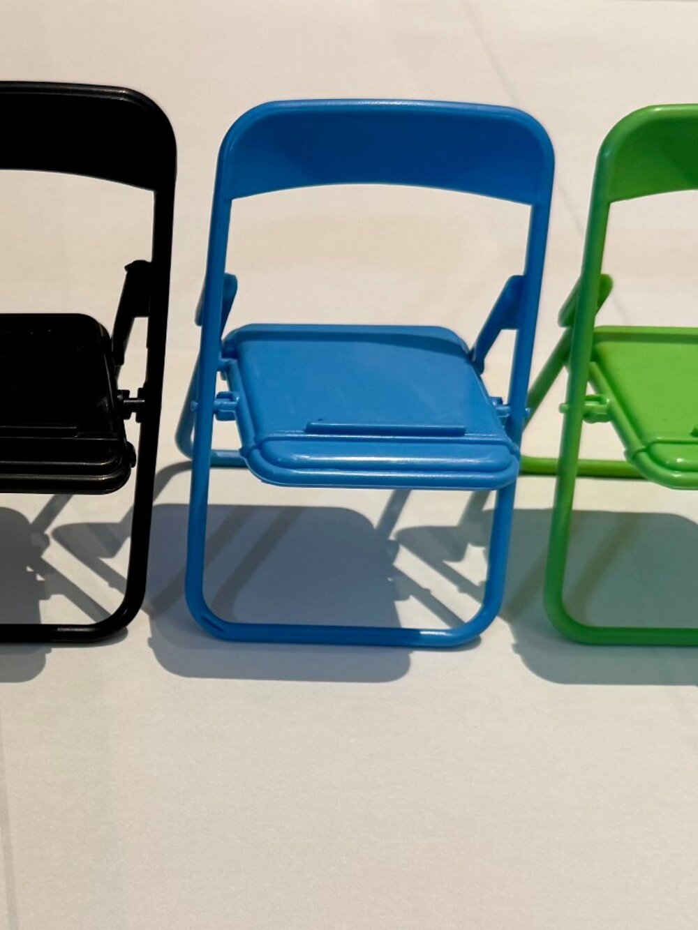 Blue Plastic Folding Chair Cell Phone Stand